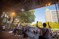 Summer festival 2022 A band plays and sings in front of spectators on a stage.