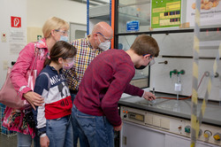 A family looks at a laboratory