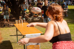 Summer festival 2022 Two people throw a ball to each other.