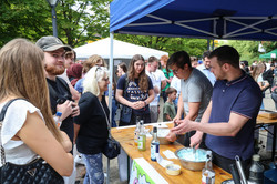 Photo: Several people order cocktails at a stand at the summer festival.