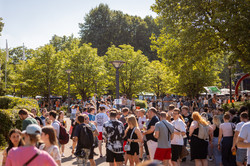 Visitors to a summer festival are on a university campus.